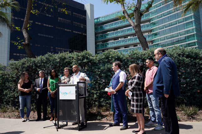 Charles Johnson IV, center, surrounded by his legal team and other supporters during a press conference outside Cedars-Sinai Medical Center, May 4, 2022, in Los Angeles.