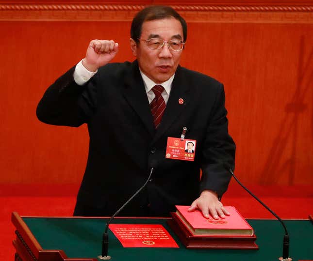 Newly elected head of the National Supervision Commission Yang Xiaodu swears an oath with his hand on the constitution during the 6th plenary session of the first session of the 13th National People's Congress (NPC) at the Great Hall of the People in Beijing, China, 18 March 2018. Delegates of the NPC vote on 18 March to decide on the appointment of the premier, and vice chairpersons of the Central Military Commission (CMC) among others. The NPC has over 3,000 delegates and is the world's largest parliament or legislative assembly though its function is largely as a formal seal of approval for the policies fixed by the leaders of the Chinese Communist Party. The NPC runs alongside the annual plenary meetings of the Chinese People's Political Consultative Conference (CPPCC), together known as 'Lianghui' or 'Two Meetings'.
