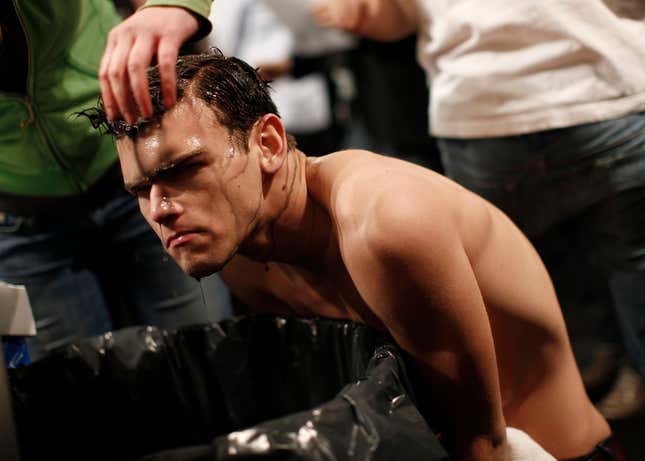 Dye is rinsed from a model’s hair.