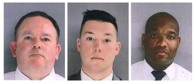 In this photo provided by the Delaware County District Attorney’s Office on Tuesday, Jan. 18, 2022, Sharon Hill Police officers Brian Devaney, left, Sean Dolan, and Devon Smith are shown. The three police officers have been charged with manslaughter and reckless endangerment after firing their weapons into a crowd of people exiting a high school football game outside of Philadelphia, killing 8-year-old Fanta Bility and injuring three people. 