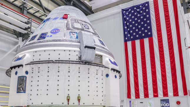 Crew Flight Test vehicle going into the Hazardous Processing Area in the Commercial Crew and Cargo Processing Facility in April 2023.
