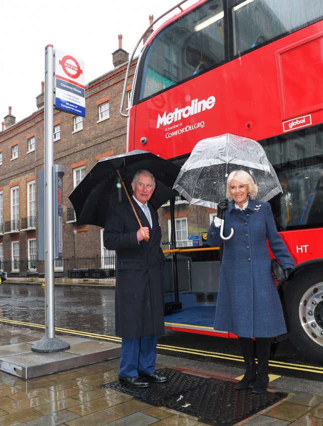 Prince Charles and Camilla prepare to board an electric double decker bus.
