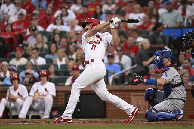 May 18, 2023; St. Louis, Missouri, USA; St. Louis Cardinals shortstop Paul DeJong (11) hits a solo home run against the Los Angeles Dodgers in the third inning at Busch Stadium.