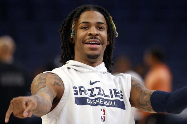 Nov 22, 2022; Memphis, Tennessee, USA; Memphis Grizzlies guard Ja Morant (12) smiles after a shot during warm ups prior to the game against the Sacramento Kings at FedExForum.