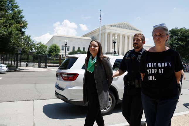 U.S. Capitol Police Officers detain Rep. Alexandria Ocasio-Cortez (D-NY) after participating in a sit-in with activists from the Center for Popular Democracy Action (CPDA) in front of the U.S. Supreme Court Building on July 19, 2022, in Washington, DC. 