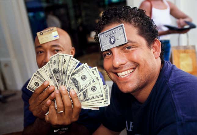 Film director and producer Brett Ratner (right) and hip-hop mogul Russell Simmons at L’Iguane restaurant, St. Barts, in 1998. Few establishments on the island accepted credit cards, and visitors often carried large amounts of cash.