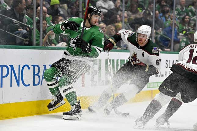 Mar 1, 2023; Dallas, Texas, USA; Dallas Stars defenseman Colin Miller (6) and Arizona Coyotes left wing Lawson Crouse (67) look for the puck in the Stars zone during the first period at the American Airlines Center.