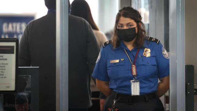 Transportation Security Administration (TSA) workers screen passengers at O’Hare International Airport on November 08, 2021 in Chicago, Illinois.