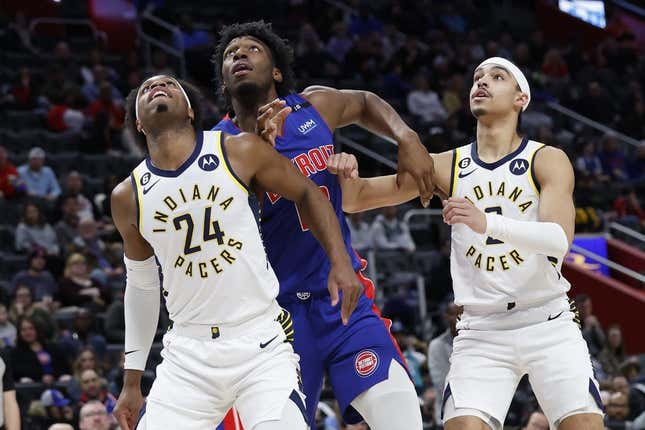 Mar 11, 2023; Detroit, Michigan, USA;  Indiana Pacers guard Buddy Hield (24) Detroit Pistons center James Wiseman (13) and Pacers guard Andrew Nembhard (2) look for a rebound in the first half at Little Caesars Arena.