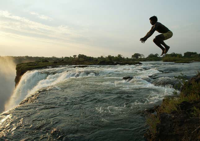 Back in 2004: A Zambian man jumps into a pool at the edge of the 110 metre high main falls of the Victoria Falls on the Zambezi River