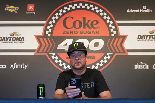 Aug 26, 2023; Daytona Beach, Florida, USA;  Kurt Busch reads from a prepared statement announcing his retirement prior to the Coke Zero Sugar 400 at Daytona International Speedway.