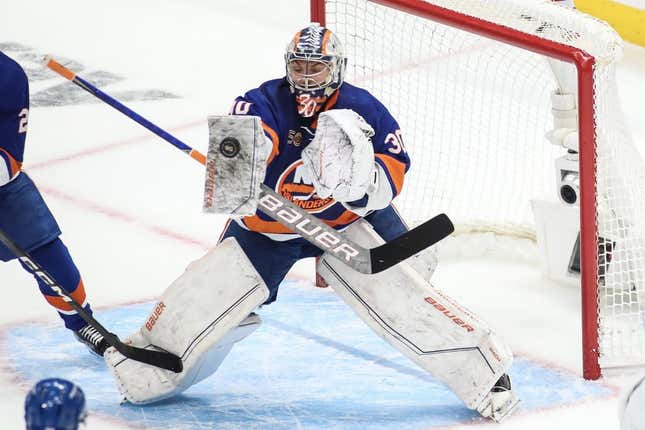 Apr 28, 2023; Elmont, New York, USA; New York Islanders goaltender Ilya Sorokin (30) stops the puck in game six of the first round of the 2023 Stanley Cup Playoffs against the Carolina Hurricanes at UBS Arena.