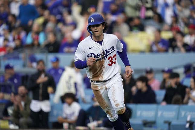 Apr 29, 2023; Los Angeles, California, USA;  Los Angeles Dodgers center fielder James Outman (33) scores a run against the St. Louis Cardinals during the second inning at Dodger Stadium.