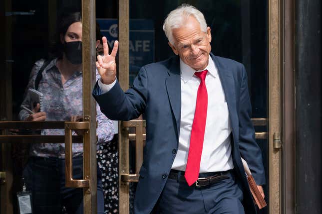 Former Trump White House official Peter Navarro gestures, Friday, June 3, 2022, as he leaves federal court in Washington. Navarro was indicted Friday on contempt charges after defying a subpoena from the House panel investigating the Jan. 6 attack on the U.S. Capitol. (AP Photo/Jacquelyn Martin)