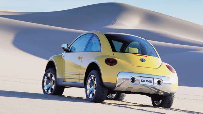 Volkswagen press image of the yellow Beetle Dune Concept 2000, viewed from a rear quarter angle and posing in the desert.