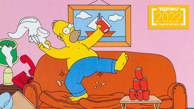 Homer Simpsons cheers and dances on top of his couch.