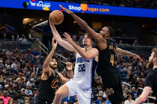Apr 4, 2023; Orlando, Florida, USA; Orlando Magic forward Franz Wagner (22) shoots the ball against Cleveland Cavaliers forward Evan Mobley (4) in the fourth quarter at Amway Center.
