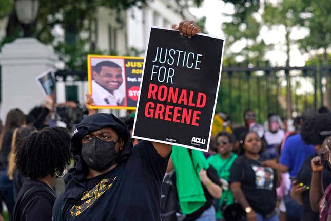 In this Thursday, May 27, 2021, file photo, demonstrators stand in front of the governor’s mansion after a march from the state Capitol in Baton Rouge, La., protesting the death of Ronald Greene, who died in the custody of Louisiana State Police in 2019. 