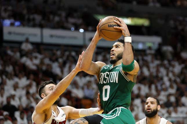 May 23, 2023; Miami, Florida, USA; Boston Celtics forward Jayson Tatum (0) shoots against Miami Heat guard Max Strus (31) in the third quarter during game four of the Eastern Conference Finals for the 2023 NBA playoffs at Kaseya Center.