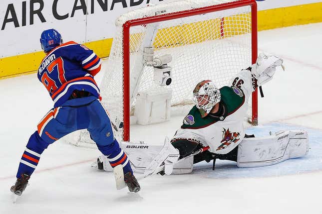 Mar 22, 2023; Edmonton, Alberta, CAN; Arizona Coyotes goaltender Connor Ingram (39) makes a save on Edmonton Oilers forward Connor McDavid (97) during overtime at Rogers Place.