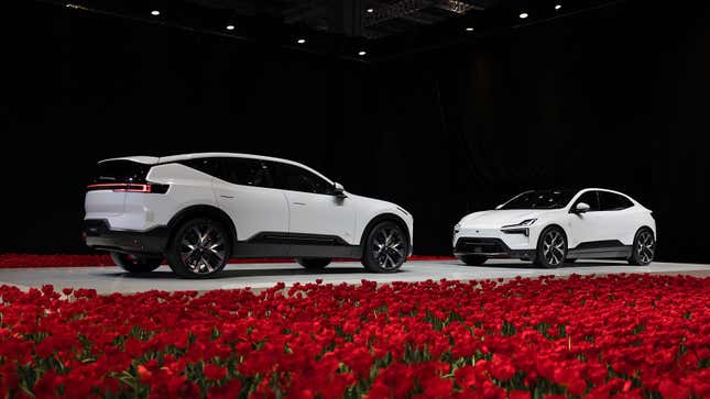A photo of a Polestar 3 and Polestar 4 SUV on stage. 