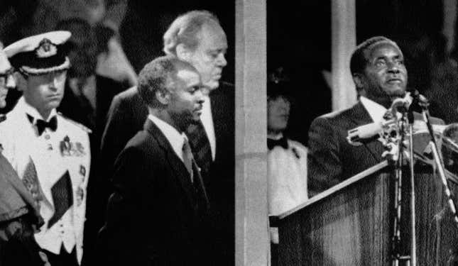 April 18, 1980, prime minister Robert Mugabe takes the oath of allegiance to Zimbabwe. R-L: British governor Lord Christopher Soames; Zimbabwe president Canaan Banana, Prince Charles; British foreign secretary Lord Carrington.