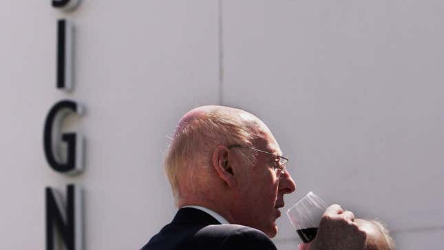 Sir Clive Sinclair having a drink of wine
