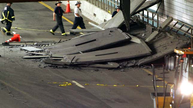 Firefighters inspect a section of ceiling in the Interstate 90 eastbound connector tunnel through Boston in this file photo taken July 11, 2006, that collapsed onto the roadway and killed a woman passenger in a car, in this Sunday, July 10, 2006. The fatal collapse raised questions about a project that has long been under scrutiny _ and exposed a confluence of events that led to the collapse. (AP Photo/Michael Dwyer