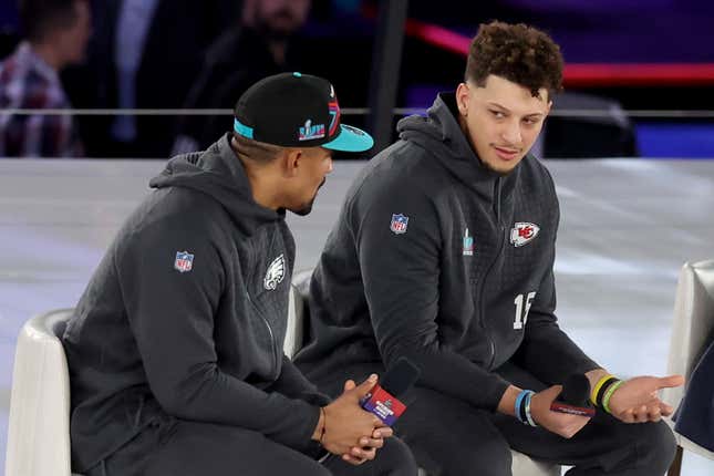 (L-R) Jalen Hurts #1 of the Philadelphia Eagles talks with Patrick Mahomes #15 of the Kansas City Chiefs during Super Bowl LVII Opening Night presented by Fast Twitch at Footprint Center on February 06, 2023 in Phoenix, Arizona. 