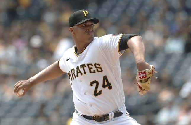 May 24, 2023; Pittsburgh, Pennsylvania, USA; Pittsburgh Pirates starting pitcher Johan Oviedo (24) delivers a pitch against the Texas Rangers during the first inning at PNC Park.