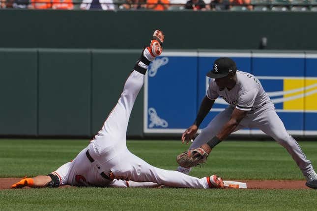 Aug 30, 2023; Baltimore, Maryland, USA; Baltimore Orioles outfielder Anthony Santander (25) slides in safely after connecting on a run scoring double in the first inning against the Chicago White Sox at Oriole Park at Camden Yards.