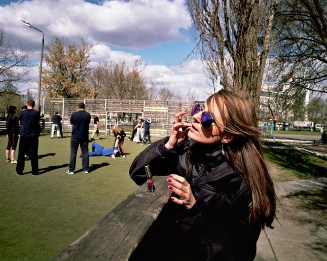 Xenia, 27, a Kyiv Police Academy cadet, doing her nails on her break from classes.