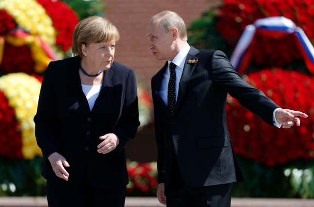 Putin and German chancellor Angela Merkel at Moscow’s Tomb of the Unknown Soldier in 2015.