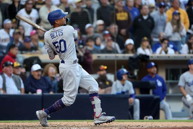 May 7, 2023; San Diego, California, USA; Los Angeles Dodgers right fielder Mookie Betts (50) hits a home run during the ninth inning against the San Diego Padres at Petco Park.
