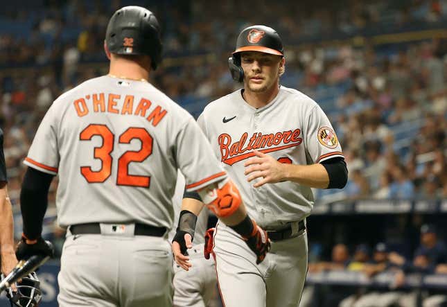 Jun 20, 2023; St. Petersburg, Florida, USA; Baltimore Orioles third baseman Gunnar Henderson (2) is congratulated by first baseman Ryan O'Hearn (32) after he scored a run against the Tampa Bay Rays during the first inning at Tropicana Field.