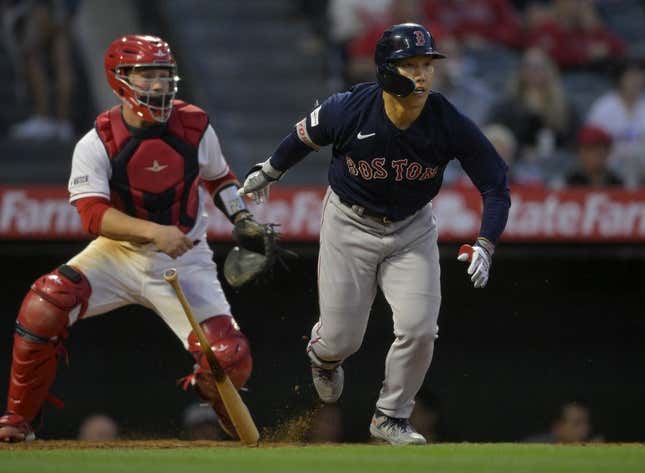 May 22, 2023; Anaheim, California, USA;  Boston Red Sox left fielder Masataka Yoshida (7) singles in a run in the sixth inning against the Los Angeles Angels at Angel Stadium.