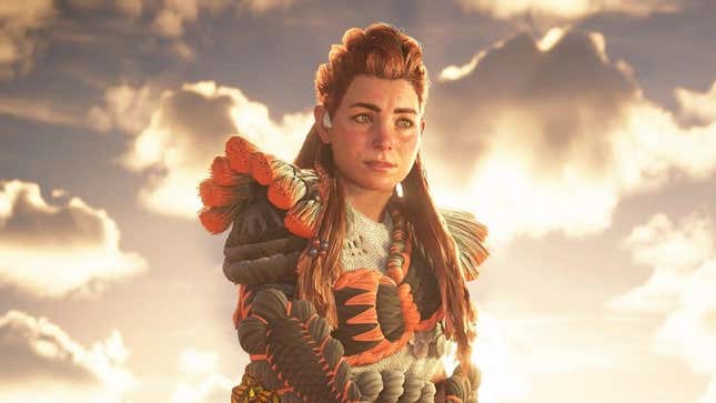 Aloy stands in front of sunlight pouring through some clouds. 