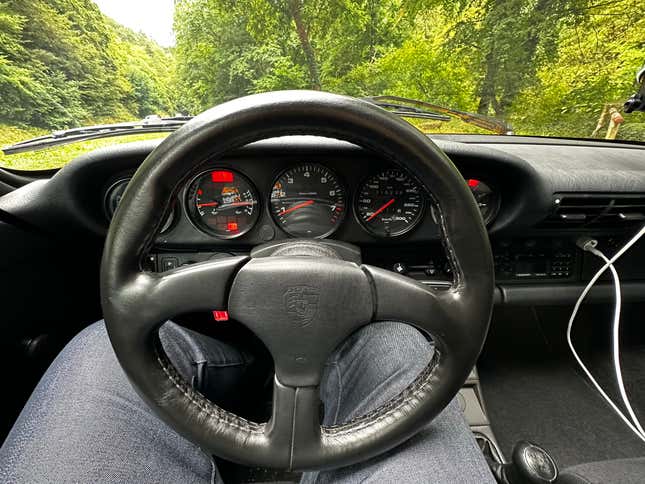 The view from the driver's seat of the steering wheel and instrument cluster of the Porsche Carrera 2 Coupe Clubsport prototype