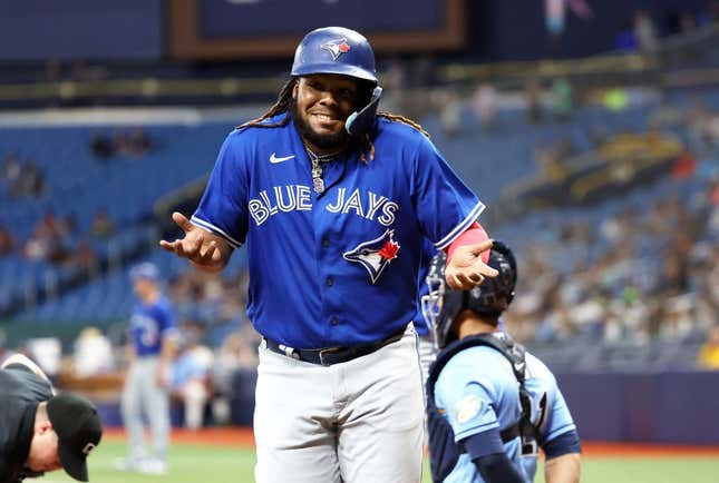 May 23, 2023; St. Petersburg, Florida, USA; Toronto Blue Jays first baseman Vladimir Guerrero Jr. (27) celebrates after he hit a grand slam against the Tampa Bay Rays during the ninth inning at Tropicana Field.