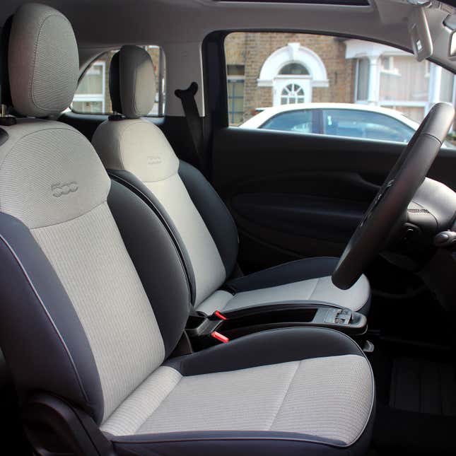 A photo of the front seats in the Fiat 500 EV. 