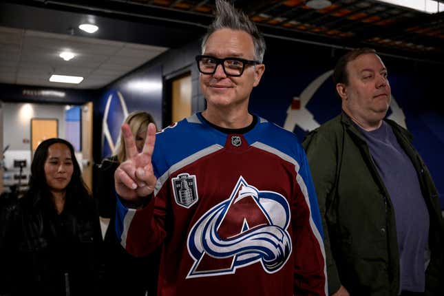 Blink 182 bassist/vocalist Mark Hoppus decked out in a Colorado Avalanche jersey