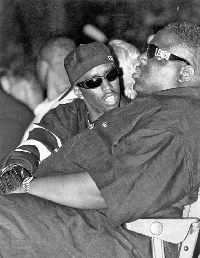 The Notorious B.I.G. and Puff Daddy take in Dr. Dre’s performance at the 1995 Source Awards at in New York, New York.