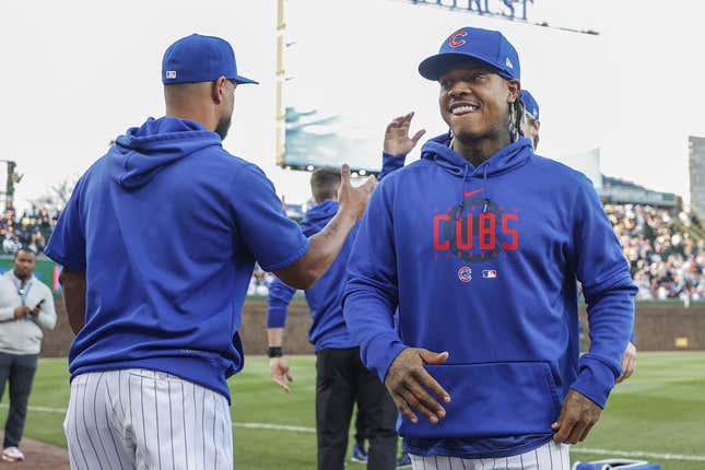 Apr 10, 2023; Chicago, Illinois, USA; Chicago Cubs pitcher Marcus Stroman (R) smiles before a baseball game against the Seattle Mariners at Wrigley Field.