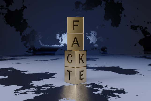 An illustration of four stacked blocks against a background of the world map. Read one way the blocks spell out "fact", read the other, they spell "fake".