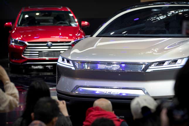 FILE - Attendees take photos of the E-SEED electric concept car during a press conference by Chinese automaker BYD at the China Auto Show in Beijing, on April 25, 2018. China&#39;s Commerce Ministry has protested a decision by the European Union to investigate exports of Chinese electric vehicles, saying Thursday, Sept. 14, 2023 that it is a “protectionist” act aimed at distorting the supply chain. (AP Photo/Mark Schiefelbein, File)