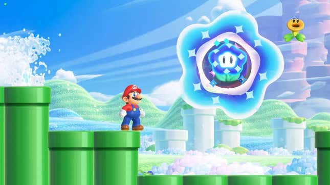 Mario looks up at a Wonder Flower while standing on some pipes. 