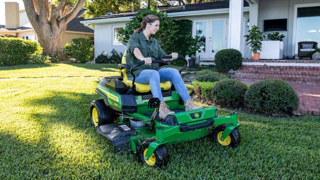 The John Deere Z370R Electric ZTrak Mower being operated on a front lawn.