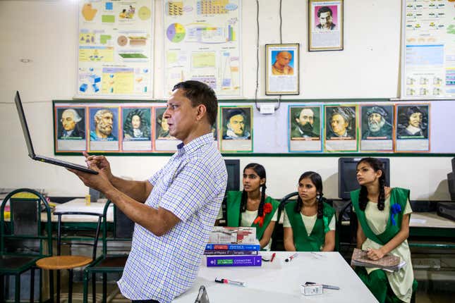 Math teacher Ashok Khugshal with his students from the senior school at Pardada Pardadi.