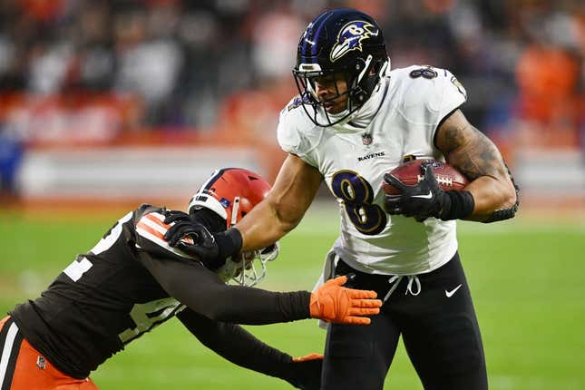 Dec 17, 2022; Cleveland, Ohio, USA; Cleveland Browns linebacker Tony Fields II (42) tackles Baltimore Ravens tight end Josh Oliver (84) during the first quarter at FirstEnergy Stadium.