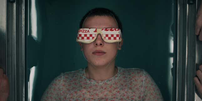 Eleven wears a mask made from a pizza box in Stranger Things season 4.
